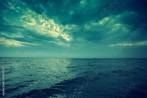 Blue vintage sunset over sea. © vvvita