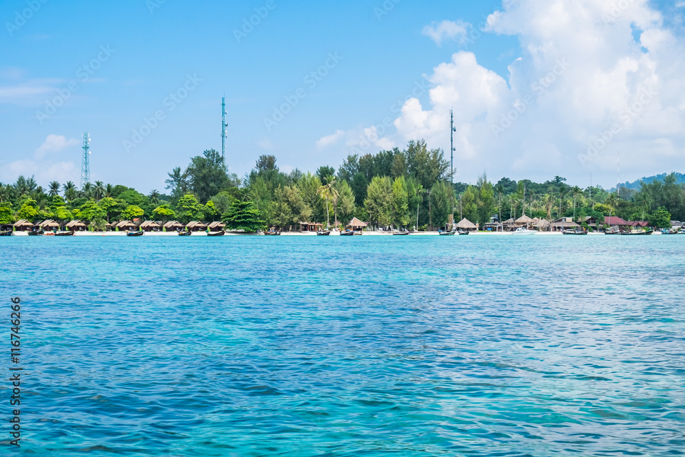 Island blue indigo sea with resort on beach, most abundant coral reef at lipe island,thailand