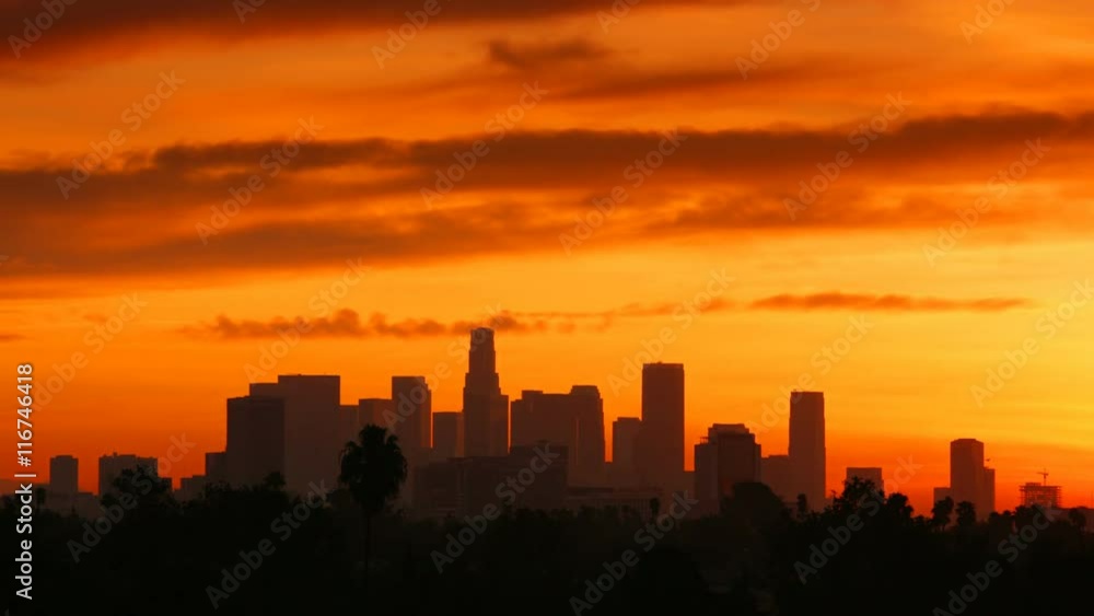 Time Lapse of the sun rising from behind the building of downtown Los Angeles. Time Lapse of the sun rising from behind the building of downtown Los Angeles.