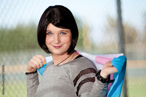 Bild auf Leinwand Transgender girl holding Trans Pride flag.