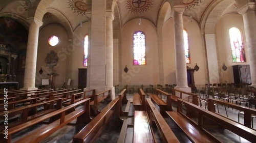 in italy turbigo inside  church religion building the altar chair desk colorated glass and window . photo