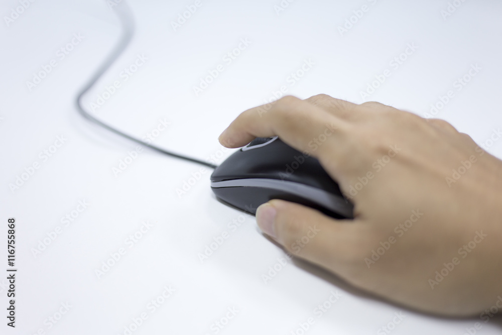 Closeup of Man hand clicking mouse
Closeup of Man hand clicking mouse