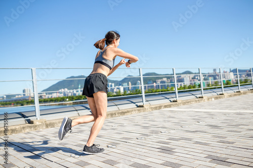 Young Woman run in a city