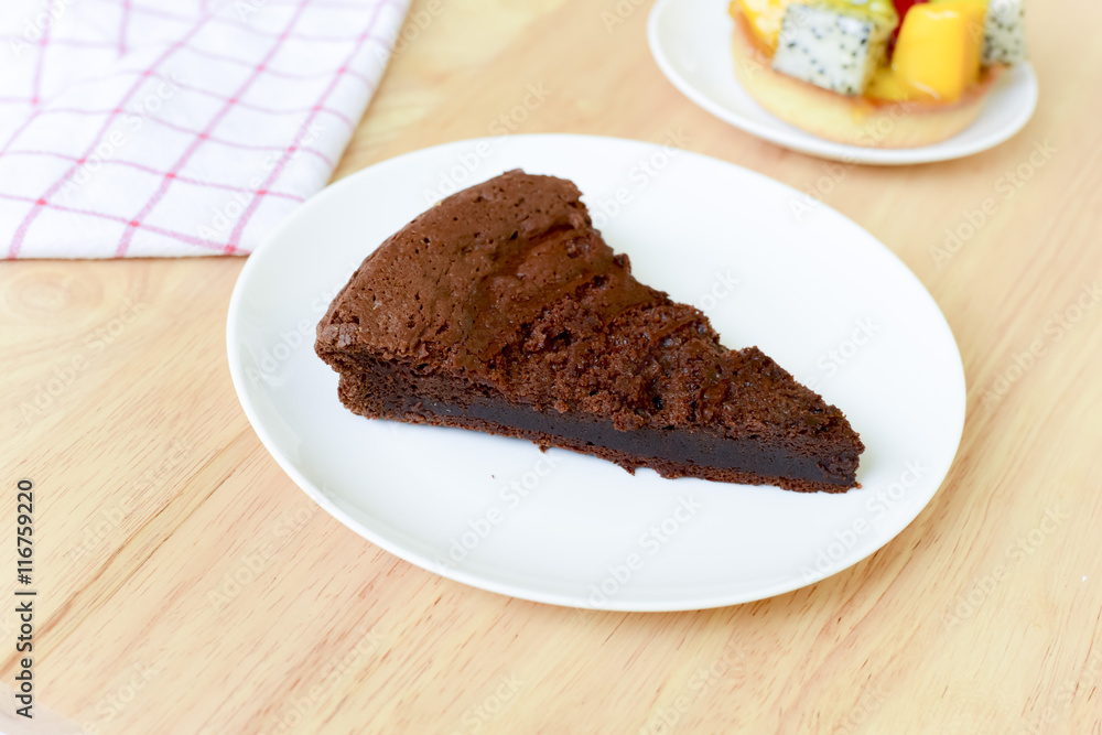 chocolate cake on wood table.