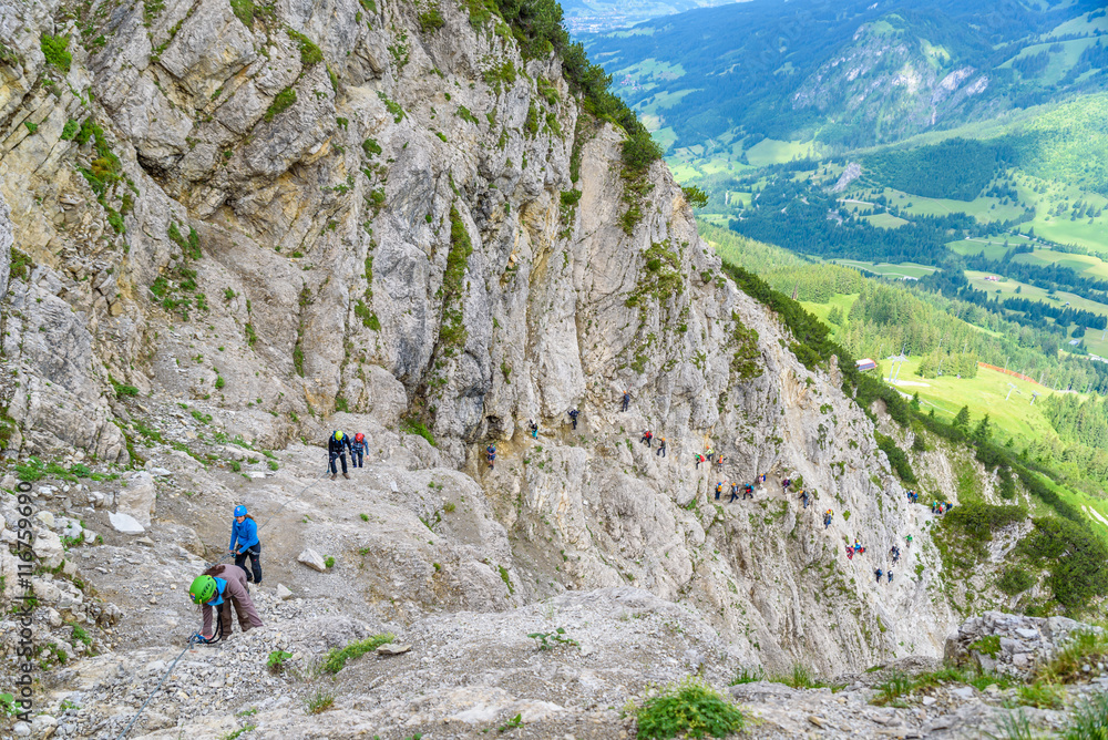 Hiker climbing in the mountain of Alps, Europe Hiker climbing in the mountain of Alps, Europe