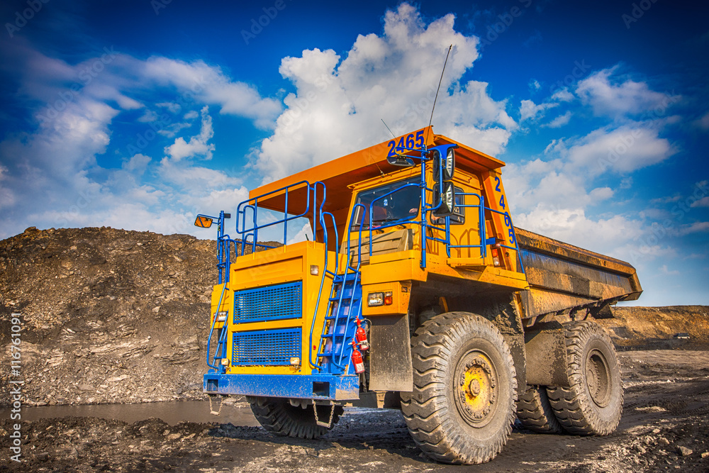 Big yellow mining truck at worksite
