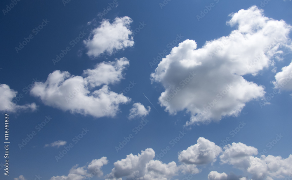 White clouds in a dark blue sky in Europe White clouds in a dark blue sky in Europe