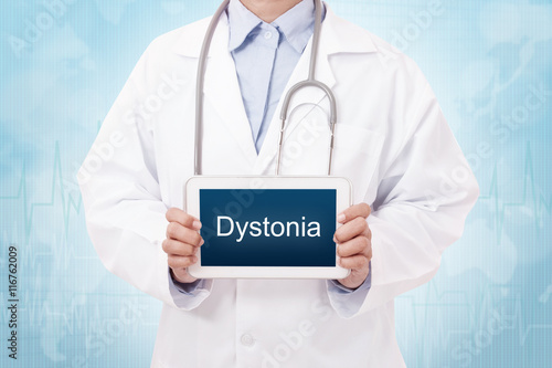 Doctor holding a tablet pc with dystonia sign on the display photo