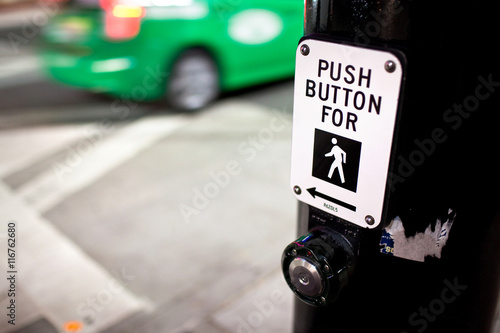 Crosswalk Button and Green Taxi