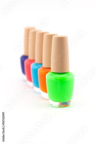 Colorful of bright nail polishes isolated on white background