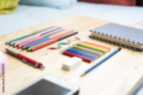 Colorfully Office and art stationery objects on wood table