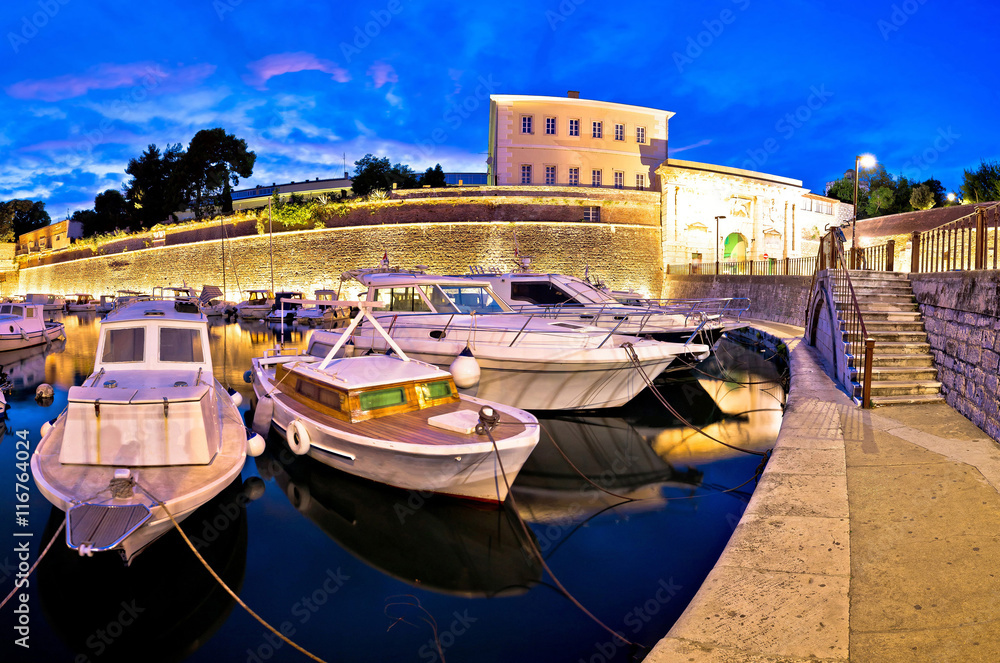 Zadar city walls and Fosa harbor evening panorama