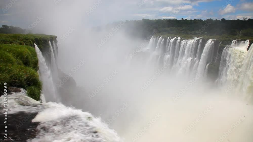 The beautiful and scenic Iguazu Falls on the border of Argentina and Brazil. The beautiful and scenic Iguazu Falls on the border of Argentina and Brazil.