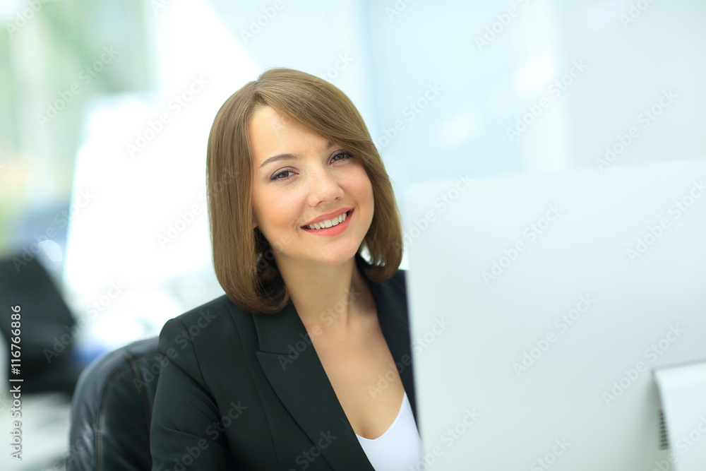 Beautiful business woman dreaming while working on computer at h