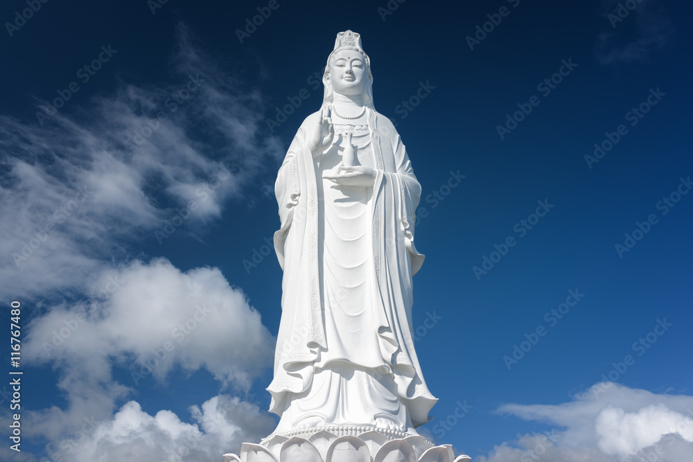 Majestic white Buddha statue on blue sky background, Vietnam Majestic white Buddha statue on blue sky background, Vietnam