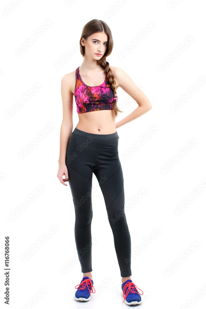 Fototapeta premium fitness woman in sport style standing against white background.