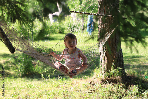 kid in hammock on nature