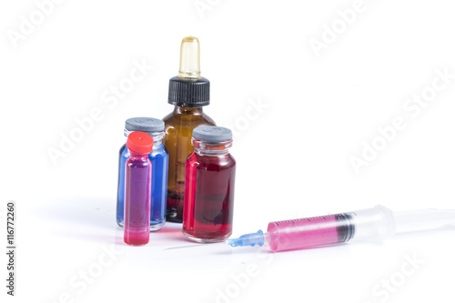medical ampoules and syringe isolated on white background.