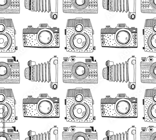 Seamless pattern background with hand drawn ornamental retro cameras. Vector illustration.