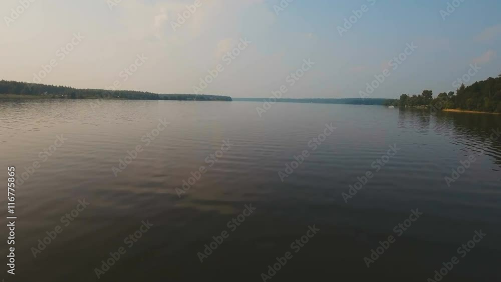 Landscape with river, forest, clouds, blue sky.Aerial view of the water surface of the river.Aerial video.4K,UHD Aerial Rural landscape. Landscape with river, forest, clouds, blue sky.Aerial view of the water surface of the river.Aerial video.4K,UHD Aerial Rural landscape.