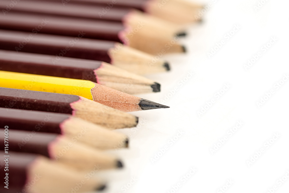 sharped yellow pencil standing out from crowd of blunted black f sharped yellow pencil standing out from crowd of blunted black f