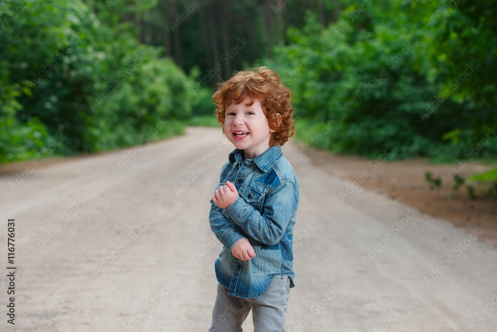 Fototapeta premium cute little emotional boy outdoors