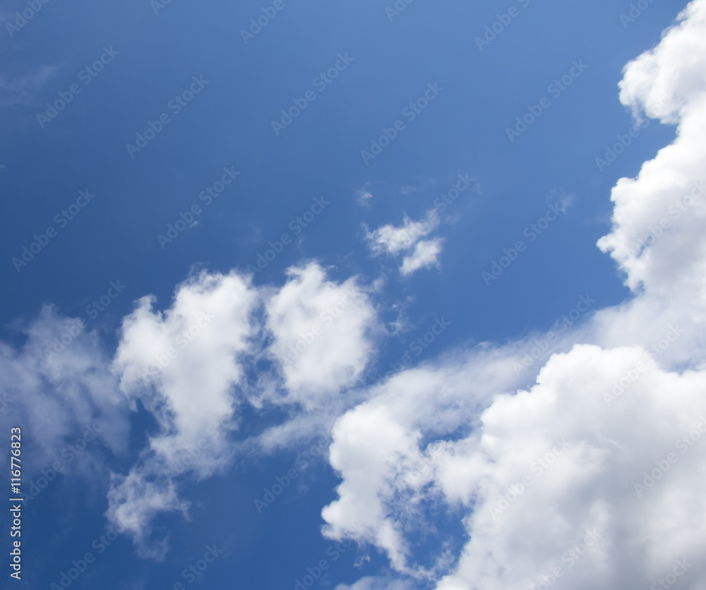 Obraz premium White clouds in a dark blue sky in Europe
