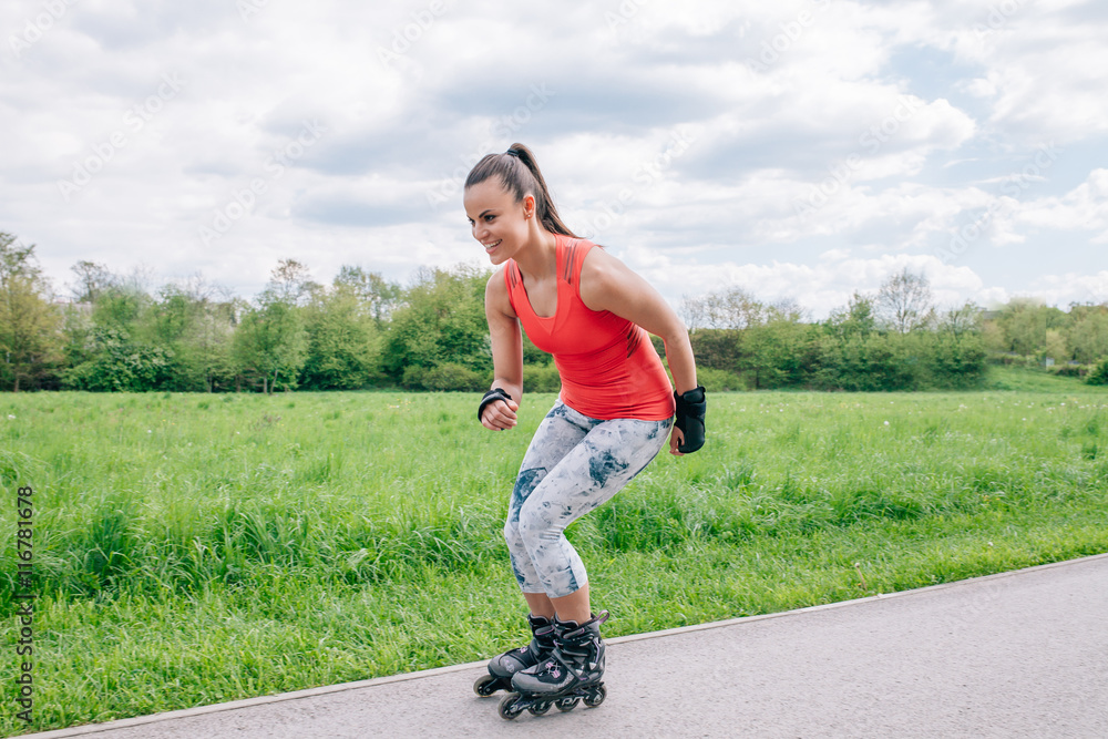 Girl wearing rollers. She is rollerskating. Girl wearing rollers. She is rollerskating.
