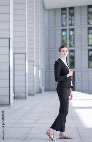 Modern business woman showing confident