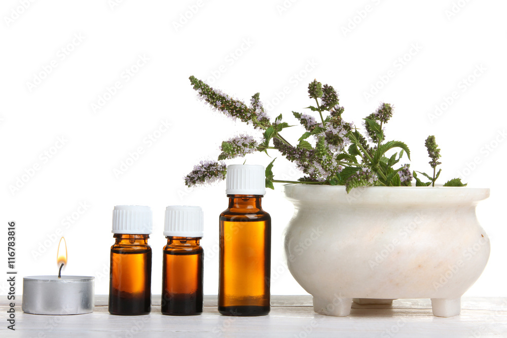 essential oil with Melissa on a white isolated background.The concept of aromatherapy essential oil with Melissa on a white isolated background.The concept of aromatherapy