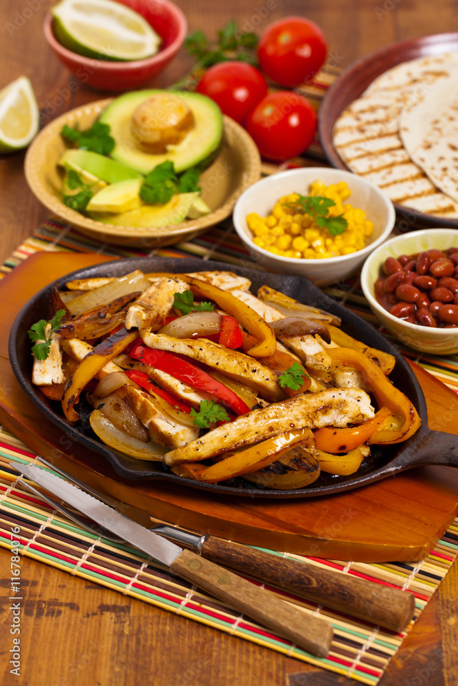 Chicken Fajitas with Grilled Onions and Bell Peppers. Selective focus. Chicken Fajitas with Grilled Onions and Bell Peppers. Selective focus.