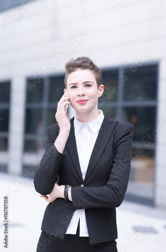 Modern business woman talking on phone