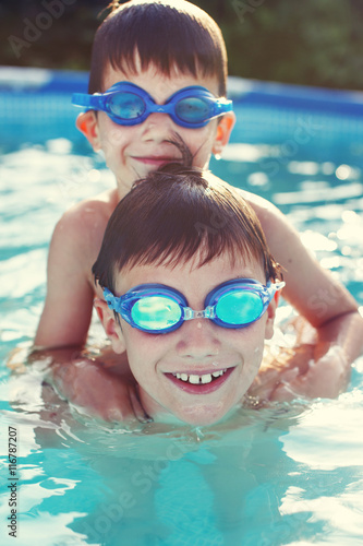 Happy little brothers in goggles swim © sakkmesterke