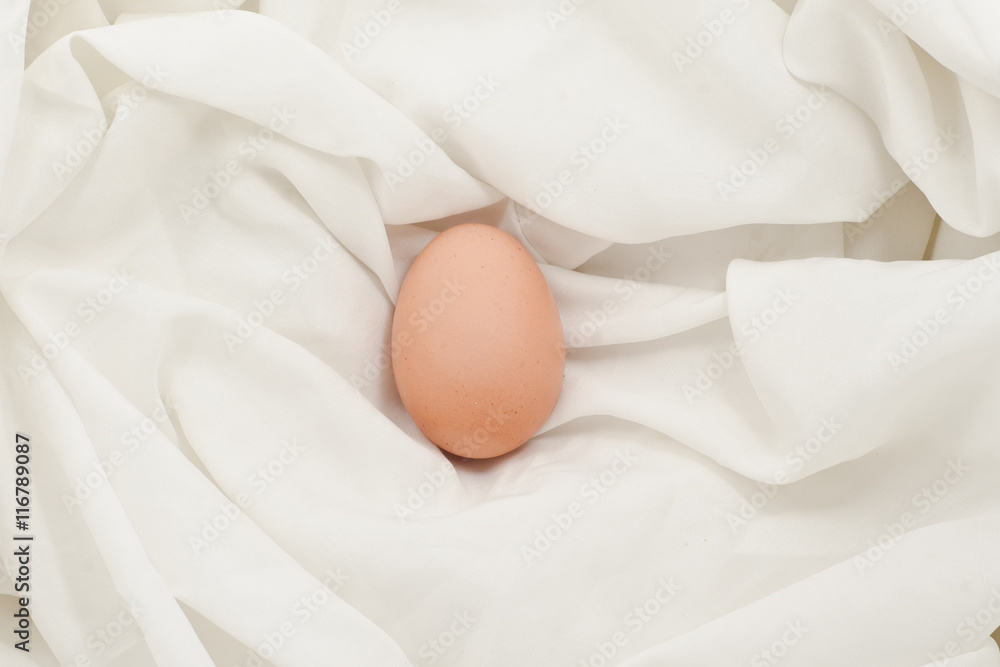 Eggs on fabric White.Chicken eggs on white fabric.easter eggs on fabric with copy space. Eggs on fabric White.Chicken eggs on white fabric.easter eggs on fabric with copy space.