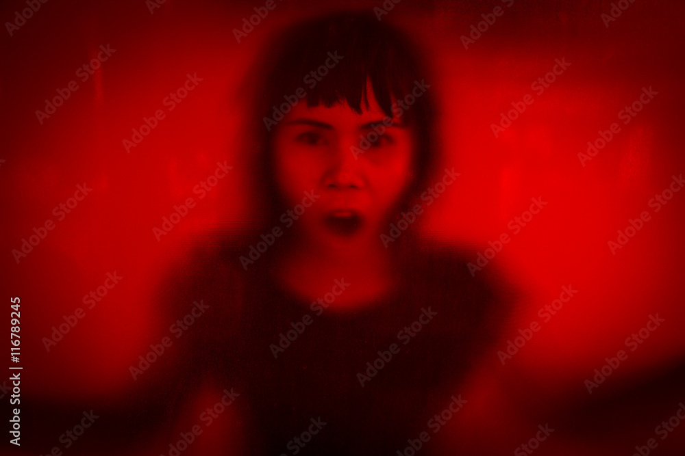 Woman screaming behind stained or dirty window glass,Scary background for book cover