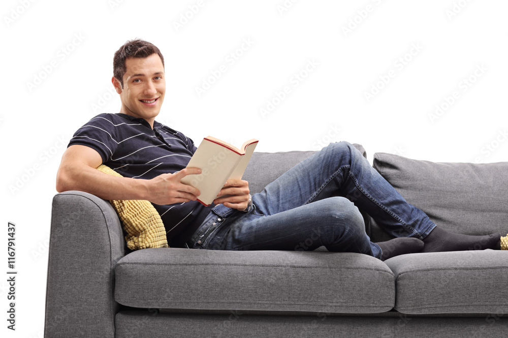 Cheerful guy holding a book