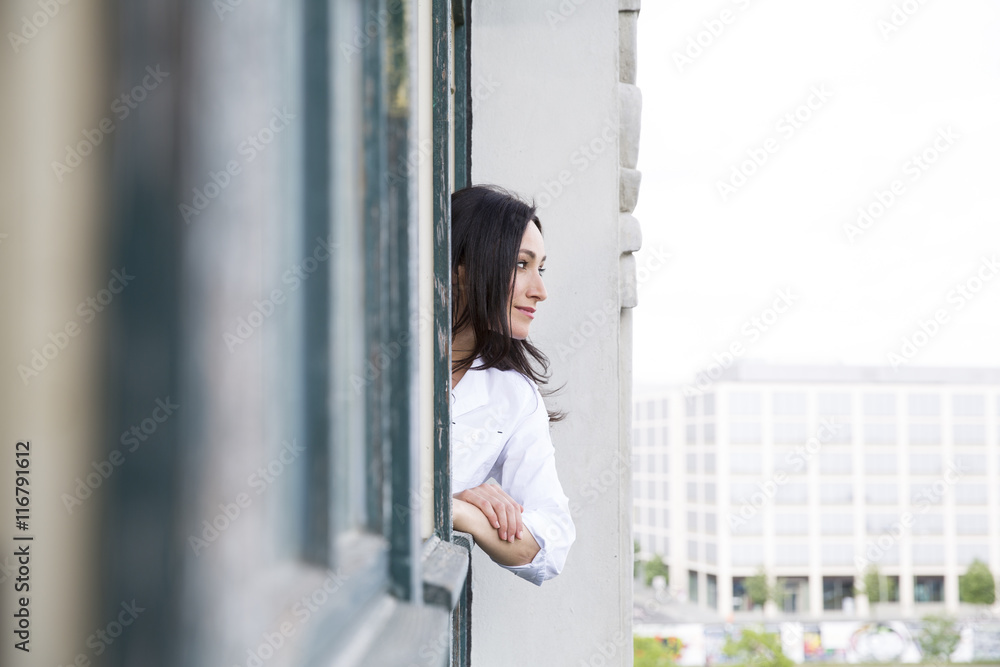Businesswoman looking out of window Businesswoman looking out of window