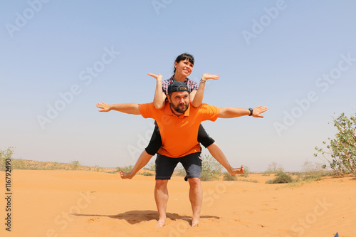Man and woman are having fun in the desert