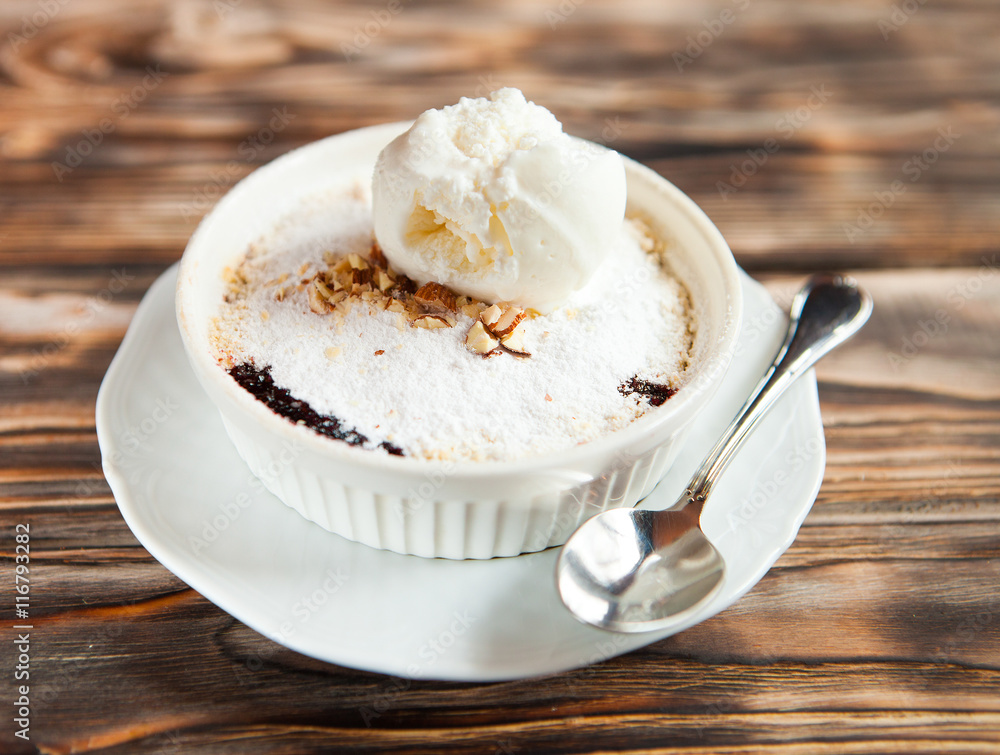 Tasty dessert with an ice cream ball on a wooden background Tasty dessert with an ice cream ball on a wooden background