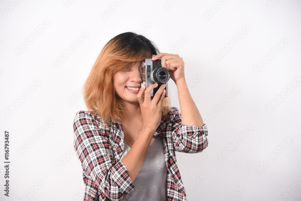 Portrait of a woman making photo on camera isolated on a white b Portrait of a woman making photo on camera isolated on a white b