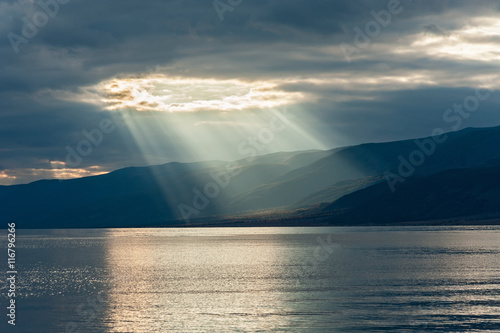 the rays of the sun passing through the clouds