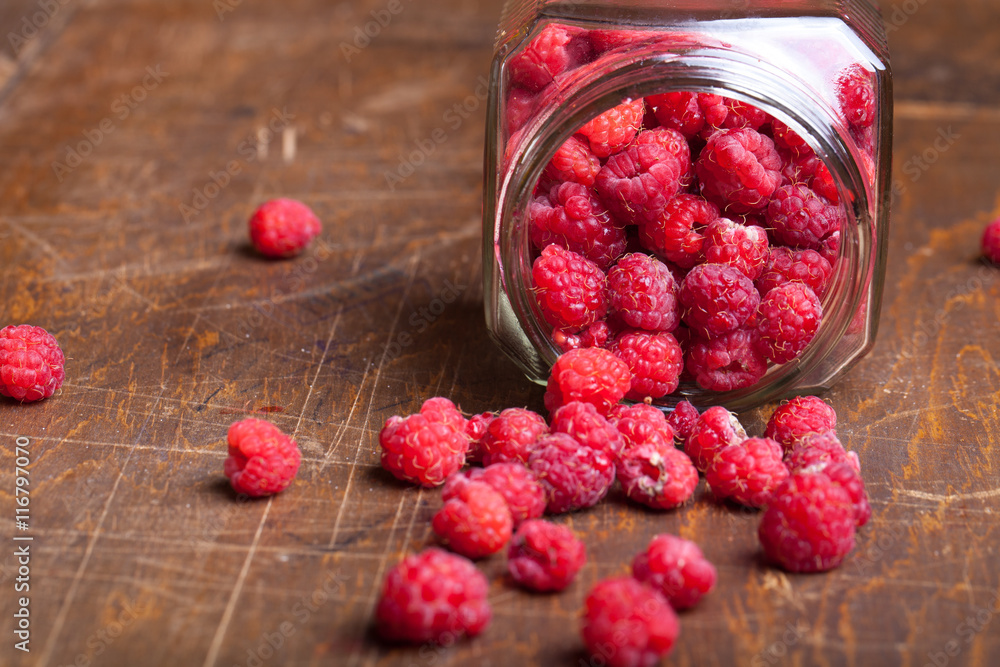 Lots of fresh bright red raspberries. Selective focus. Shallow d Lots of fresh bright red raspberries. Selective focus. Shallow d