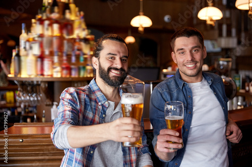 Photography happy male friends drinking beer at bar or pub