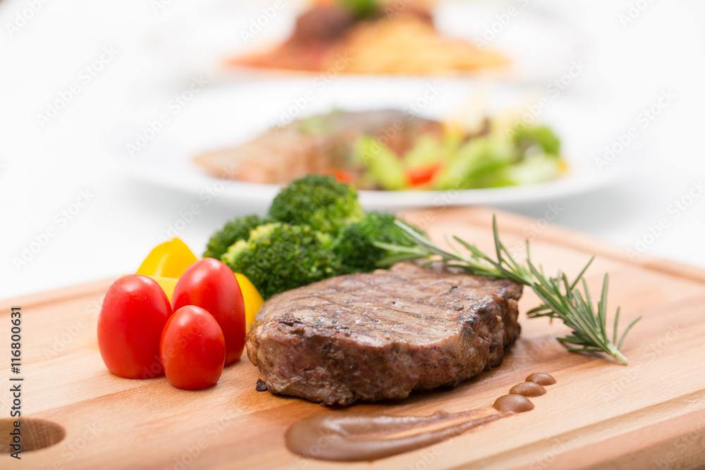 Grilled beef steak serve with colorful vegetable prepare to serve Grilled beef steak serve with colorful vegetable prepare to serve
