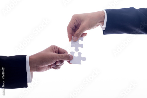 Teamwork concept with hand puzzle up puzzle with white background