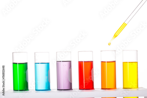 Chemistry test in flask glassware in laboratory with white background