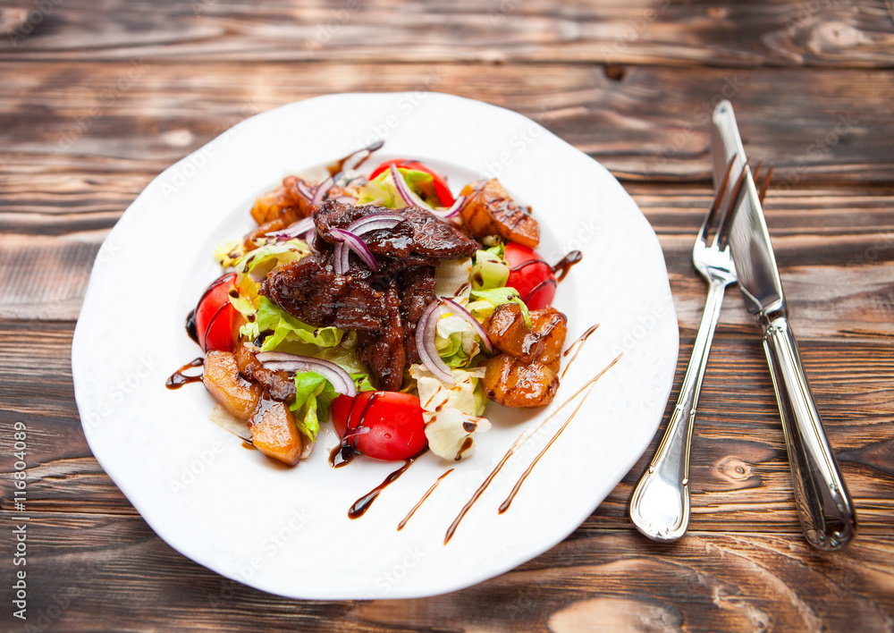Meat and vegetables salad decorated with teriyaki sauce Meat and vegetables salad decorated with teriyaki sauce