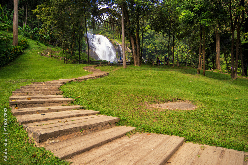 Fototapeta premium walk way in jungle to vachiratarn waterfall is a beautiful water