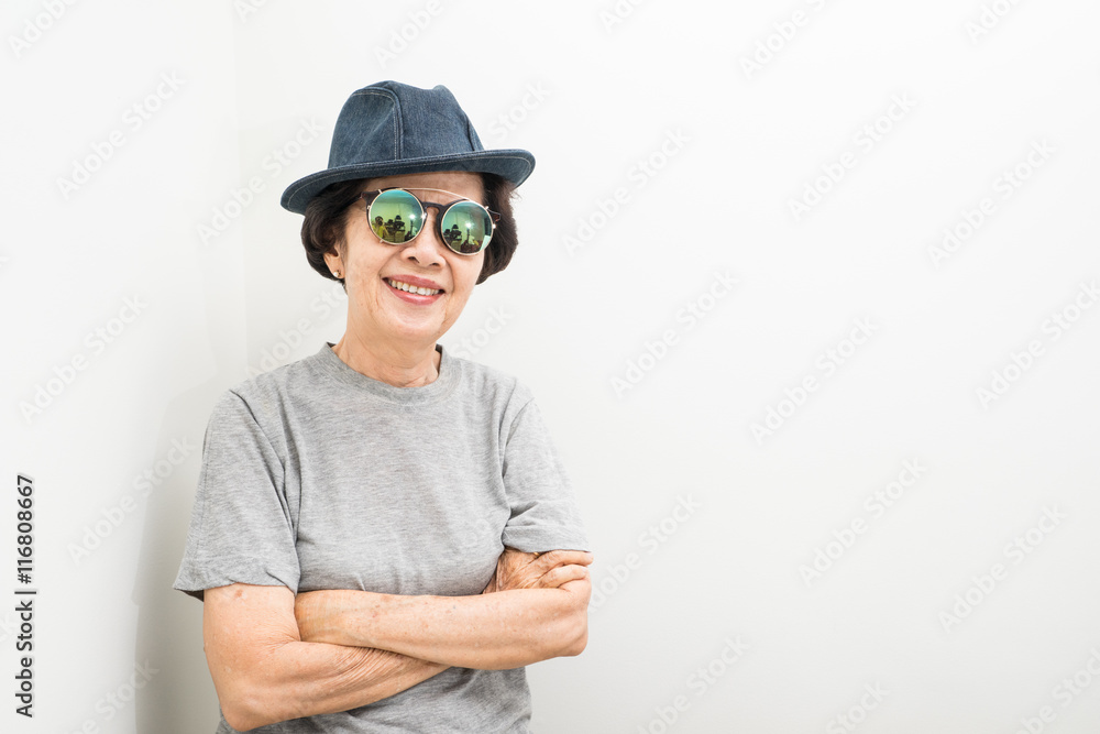 old women wear hat and sunglasses smailling with text space old women wear hat and sunglasses smailling with text space