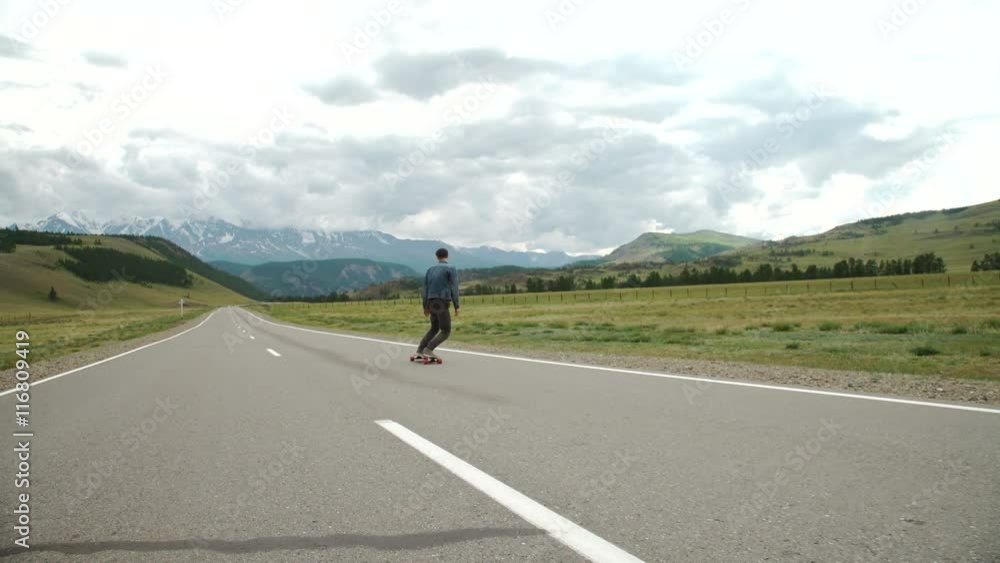 hipster man longboarding extremely action in highway. hipster man longboarding extremely action in highway.